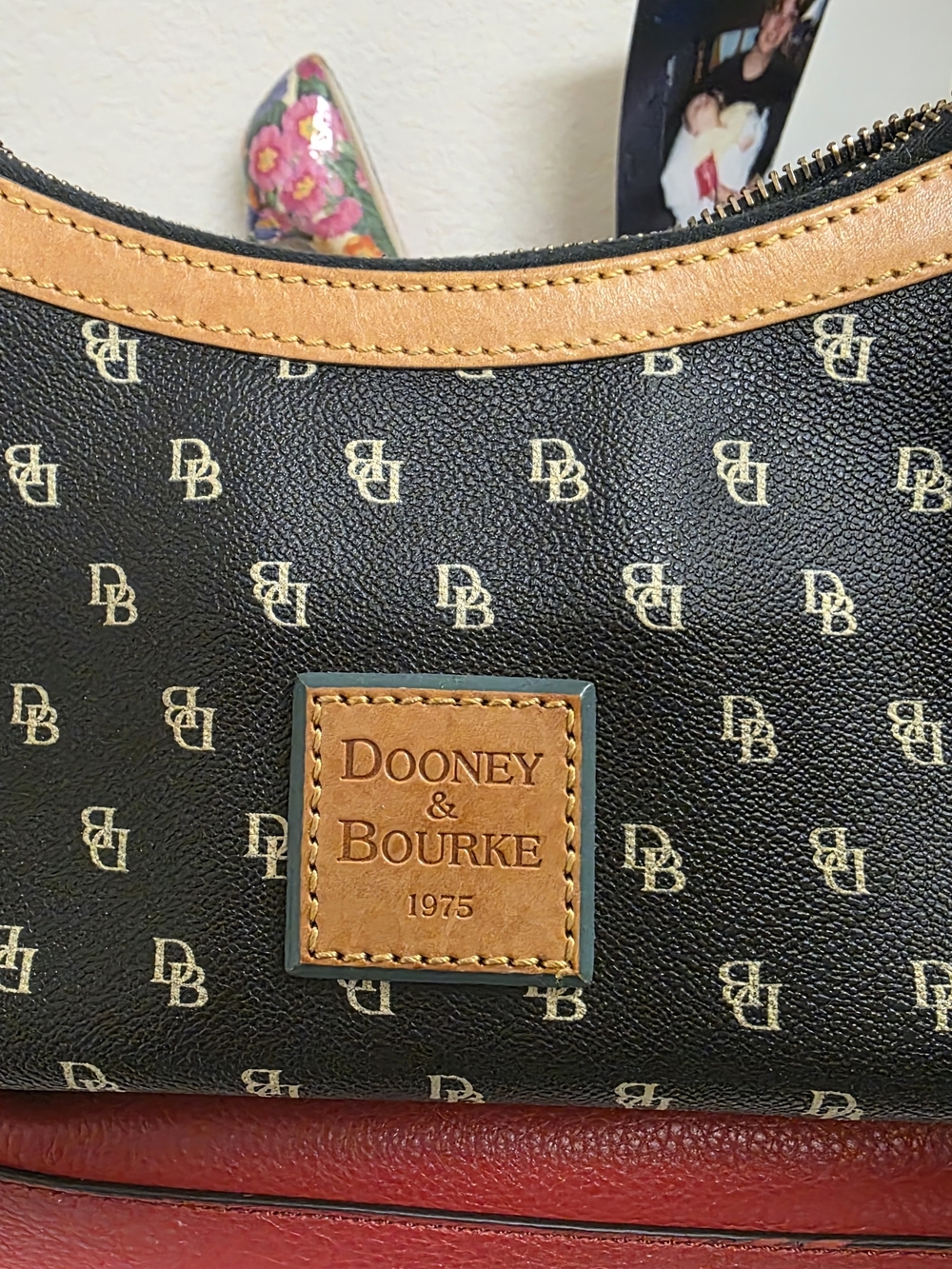 Dooney & Bourke Black Logo Shoulder Bag with Tan Trim and Red Base